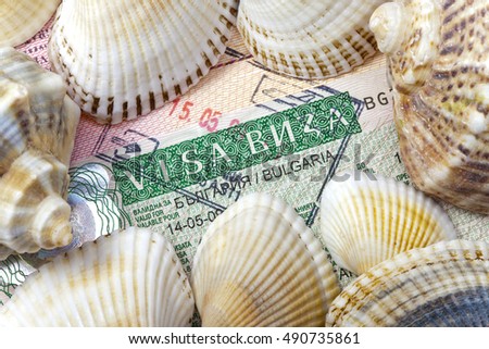 visa of Bulgaria on the page of the passport and sea shells

