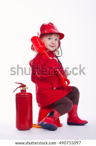little serious firefighter on white background
