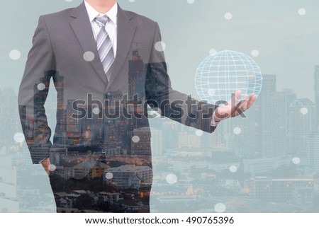 double exposure of businessman holding globe network concept