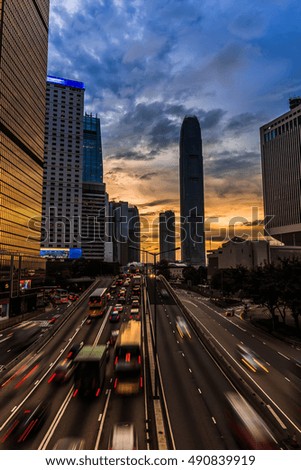 traffic in hong kong city at sunset
