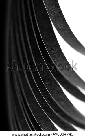 curled in a roll black paper ribbon. Macro lens closeup shot 1:1