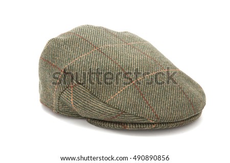 Cutout of a green tweed hunting hat or flat cap Royalty-Free Stock Photo #490890856