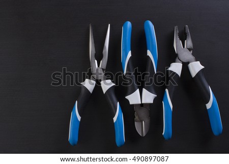Pliers on a black background