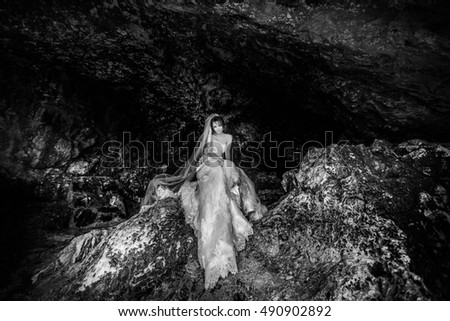 tired bride sits on the rock