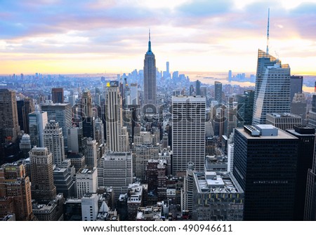A classic photo of a scenic sunset with the skyscrapers of New York City
