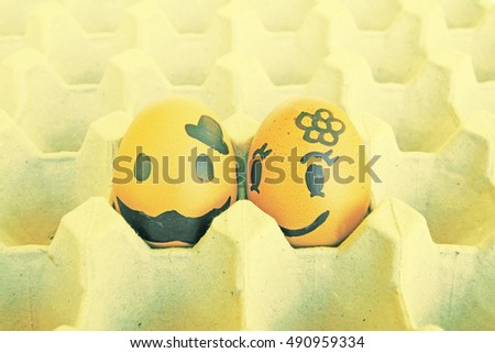 Two eggs love couple arranged in carton