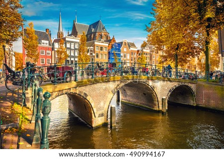 Bridges over canals in Amsterdam at autumn Royalty-Free Stock Photo #490994167