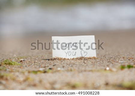 I love you - sign lays on the beach