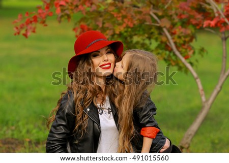 Daughter kissing mother. Family lifestyle concept.