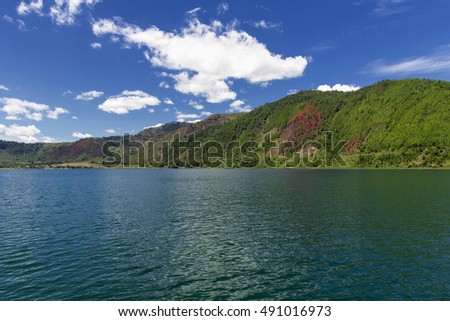 blue sky and clouds in Lake Toba,, with a beautiful view of the hills around Lake Toba,taken from ships

