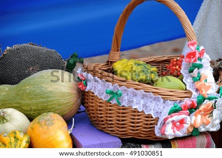 Harvest time still life of basket and squashes