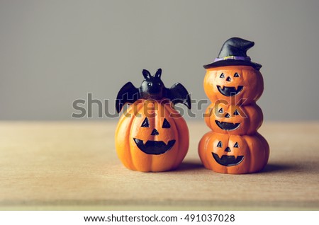 Happy Halloween, Two Pumpkin on table wood with gray wall background, halloween concept. Copy space. retro effect.