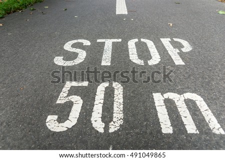 Stop 50 meters on city asphalt on floor