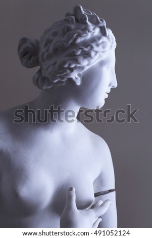 Antique sculpture Venus Aphrodite light and shadow photography. Art studio academy interior. Female portrait sculpture art