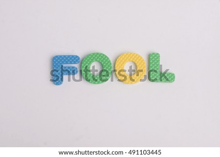 Colorful wording of FOOL on an isolated background