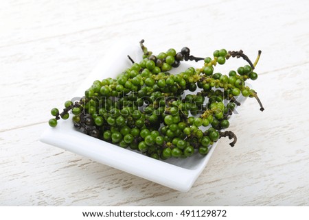 Green pepper corn on the branch in plate