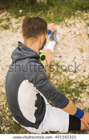 Young Athlete Doing Stretching Exercises