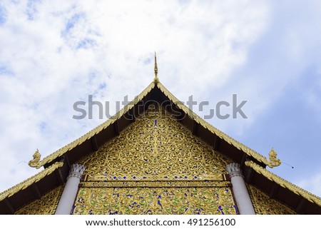 Roof of golden temple with sky