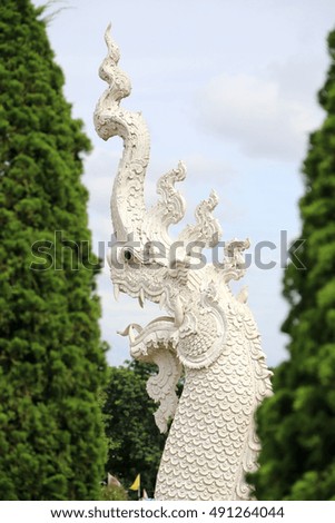The statue of a The white serpent in Thailand.