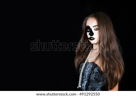 Halloween. Girl in carnival costume and makeup