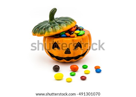 Halloween Jack o Lantern pail overflowing with colorful chocolate