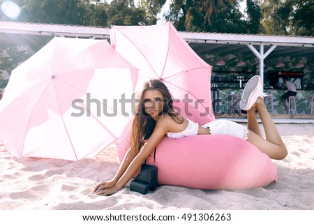 Fashionable colored image,magenta colors,filter,Outdoor summer smiling lifestyle portrait of pretty young woman