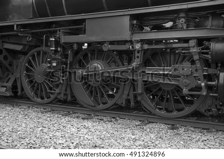Black and whit photo of Big Wheels of vintage steam train. Originally is this a color photo, but converted to black and white.