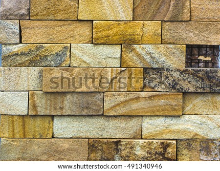 texture of yellow sandstone bricks close-up, pattern