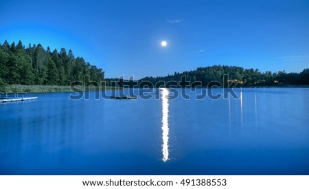 A peaceful lake in the night during summer in Scandinavia (Sweden)
