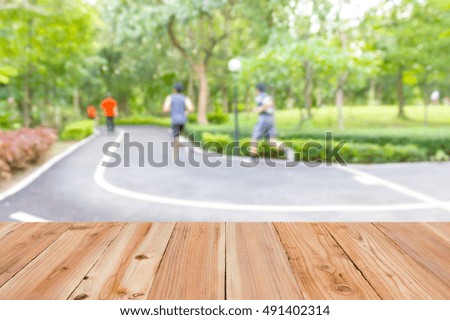 Blur image of people exercise in the park, use for background.