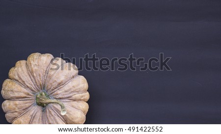 Halloween pumpkin on dark background flat lay