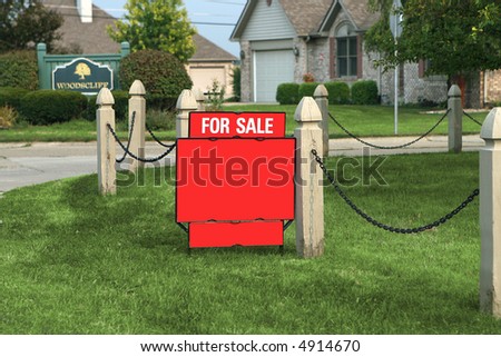 for sale sign in front yard