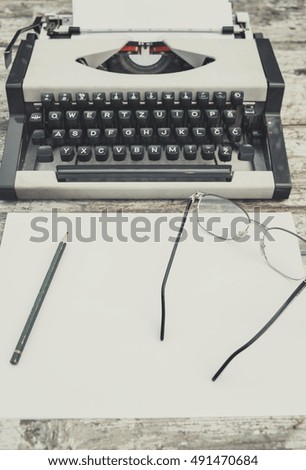 Old typewriter on the old table