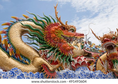 Dragon sculpture on blue sky background
