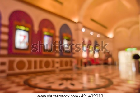 Abstract blurred image of lobby of movie theater for background
