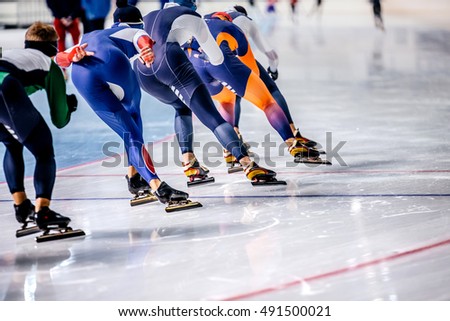 group of men skating on ice sports arena. warm-up before competitions in speed skating Royalty-Free Stock Photo #491500021
