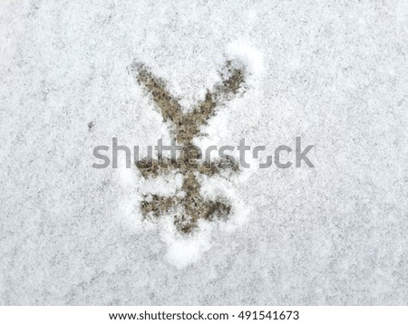 Yen currency symbol drawing on the white and clear snow, copy space