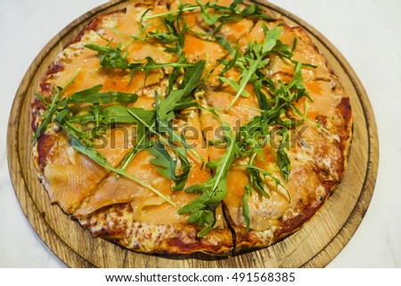 Smoked salmon, thin crust italian pizza / Food background / Popular with the younger generation and light eaters
