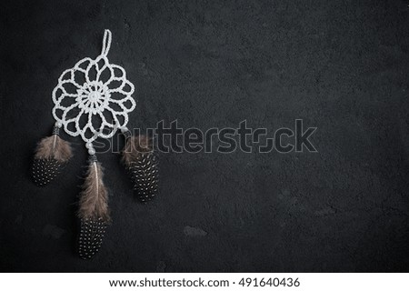 Dream catcher on a black background. Space for text. Copy space. 
