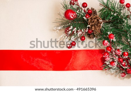 Christmas card with a ribbon and fir branches