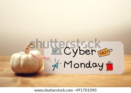 Cyber Monday message with a white small pumpkin