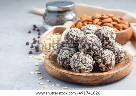 Healthy homemade paleo chocolate energy balls with rolled oats, nuts, dates and chia seeds, horizontal, copy space Royalty-Free Stock Photo #491741026