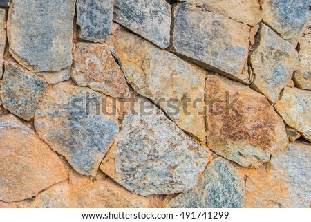 pattern gray color of modern style design decorative
uneven cracked real stone wall surface with cement,stone wall,
cracked stone wall background and texture,stone texture closeup wall