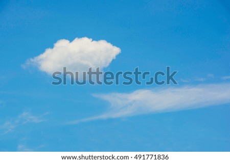 WHITE CLOUD IN CLEAR-BLUE SKY BACKGROUND
