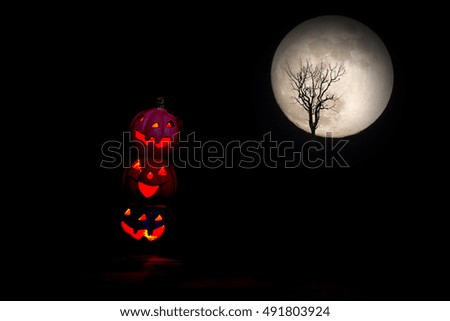 Halloween,pumpkins. full moon and death tree background 
