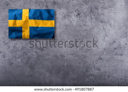 Flags of the Sweden on concrete background.