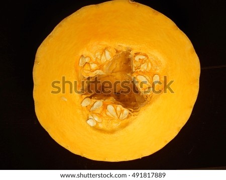 Picture shows the whole vegetable yellow pumpkin seed, stem cut slices, natural plant product isolated closeup. Pumpkin drawing consisting of photo ripe fresh food autumn orange. Eat sweets pumpkins.