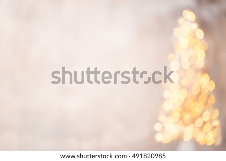Defocused christmas tree silhouette with blurred lights.