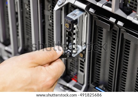 Engineer's Hand Working On Server At Data Center Royalty-Free Stock Photo #491825686
