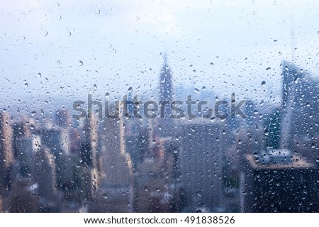 New York city : Empire State Building window view with the rain outside, Manhatta, USA